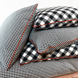 20" x 20" Cover in Black Buffalo Check Bias & Red Pipe